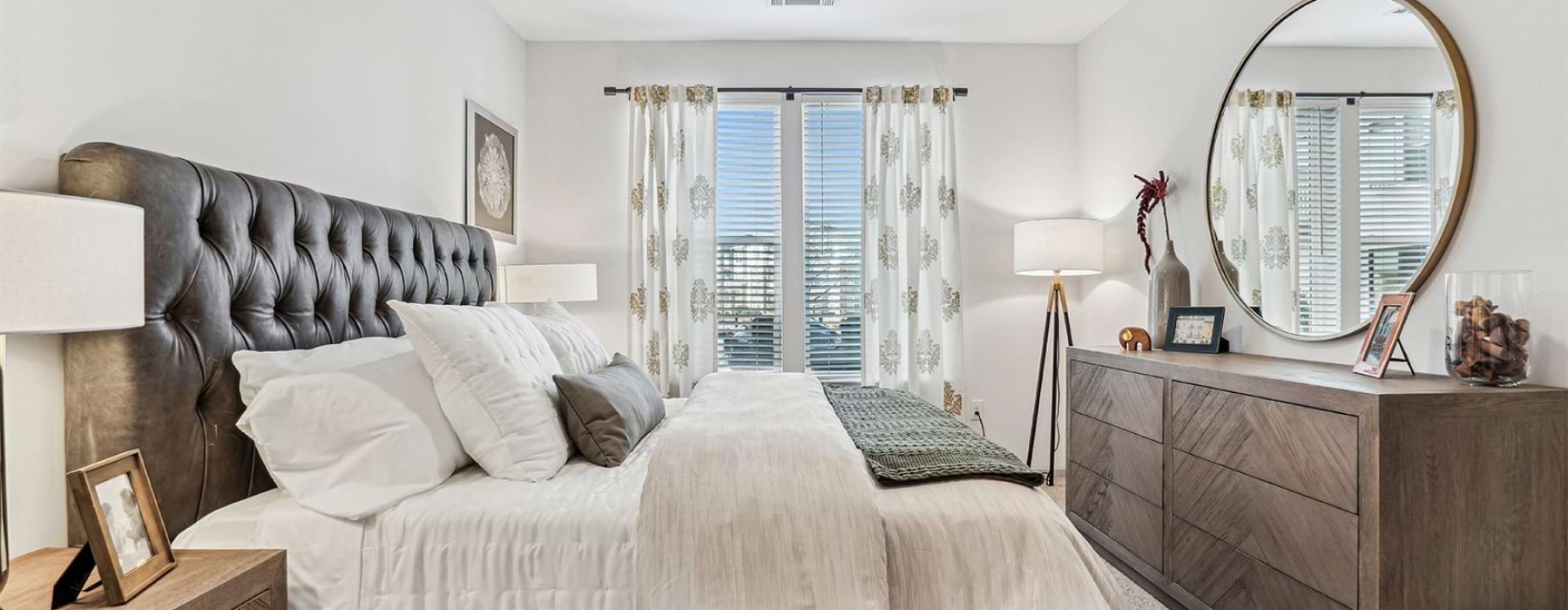 Bedroom with bed dresser and two nightstands