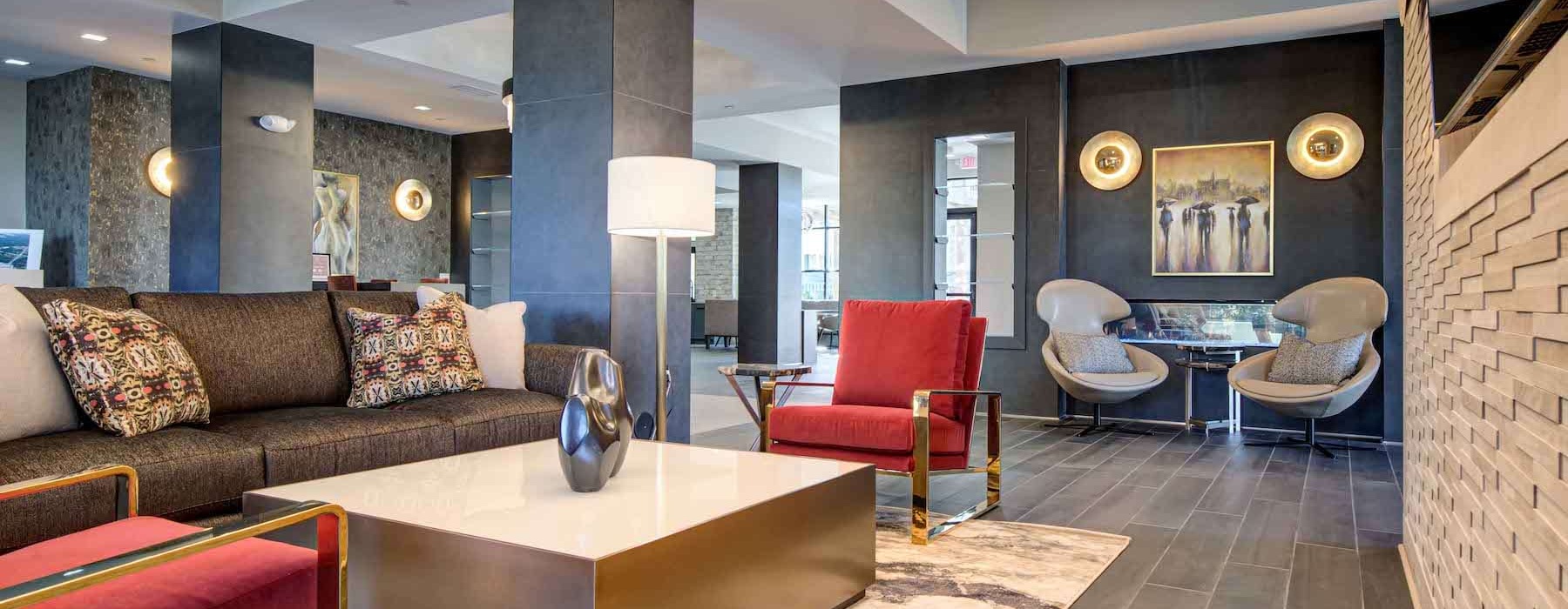 Modern-styled resident lounge with warm overhead lights